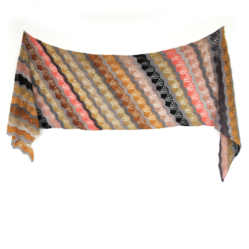 Lamina Wrap knitted shawl by Ambah O'Brien hanging on wall